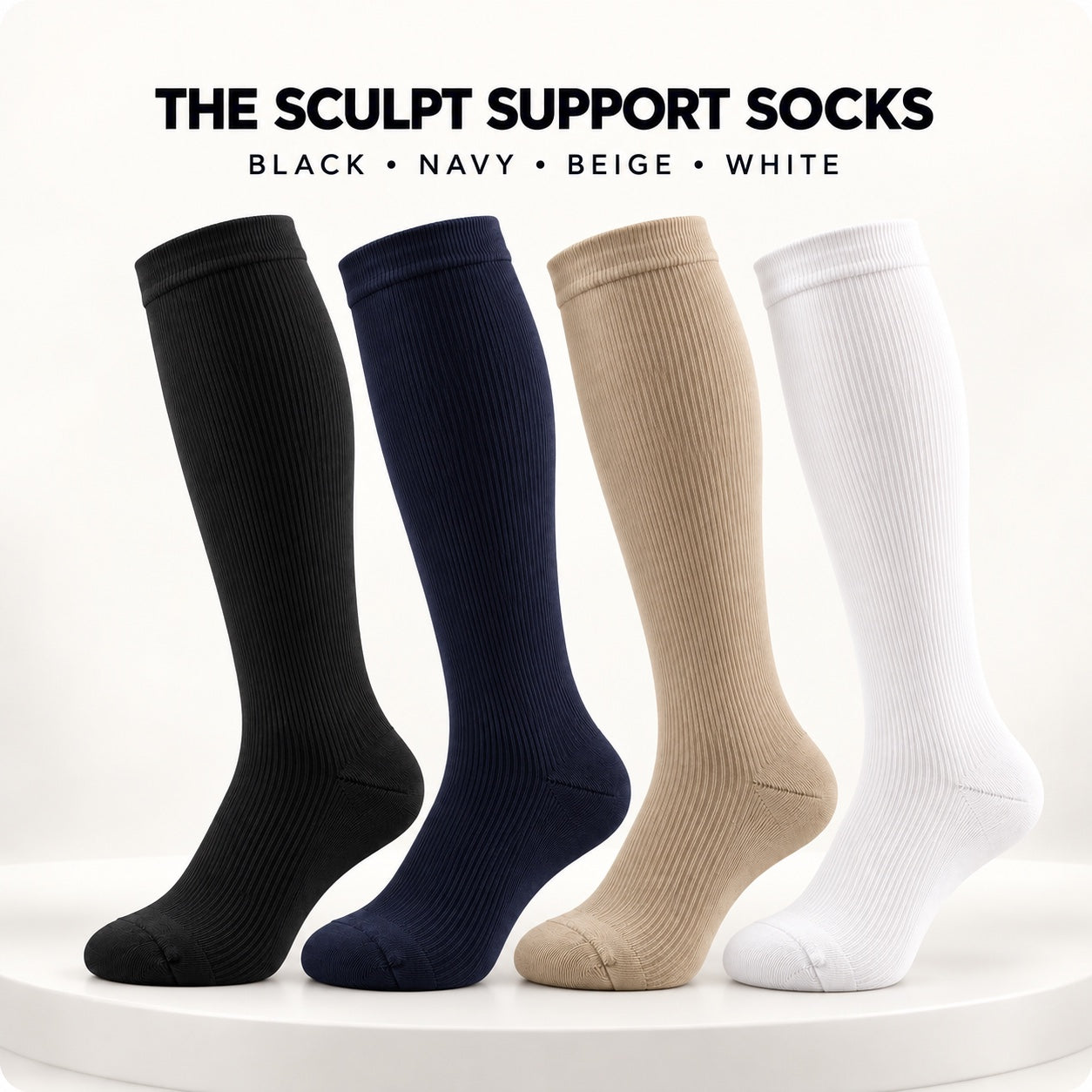 Black navy beige and white DEFYNMEN Sculpt Support Socks arranged on a warm studio pedestal