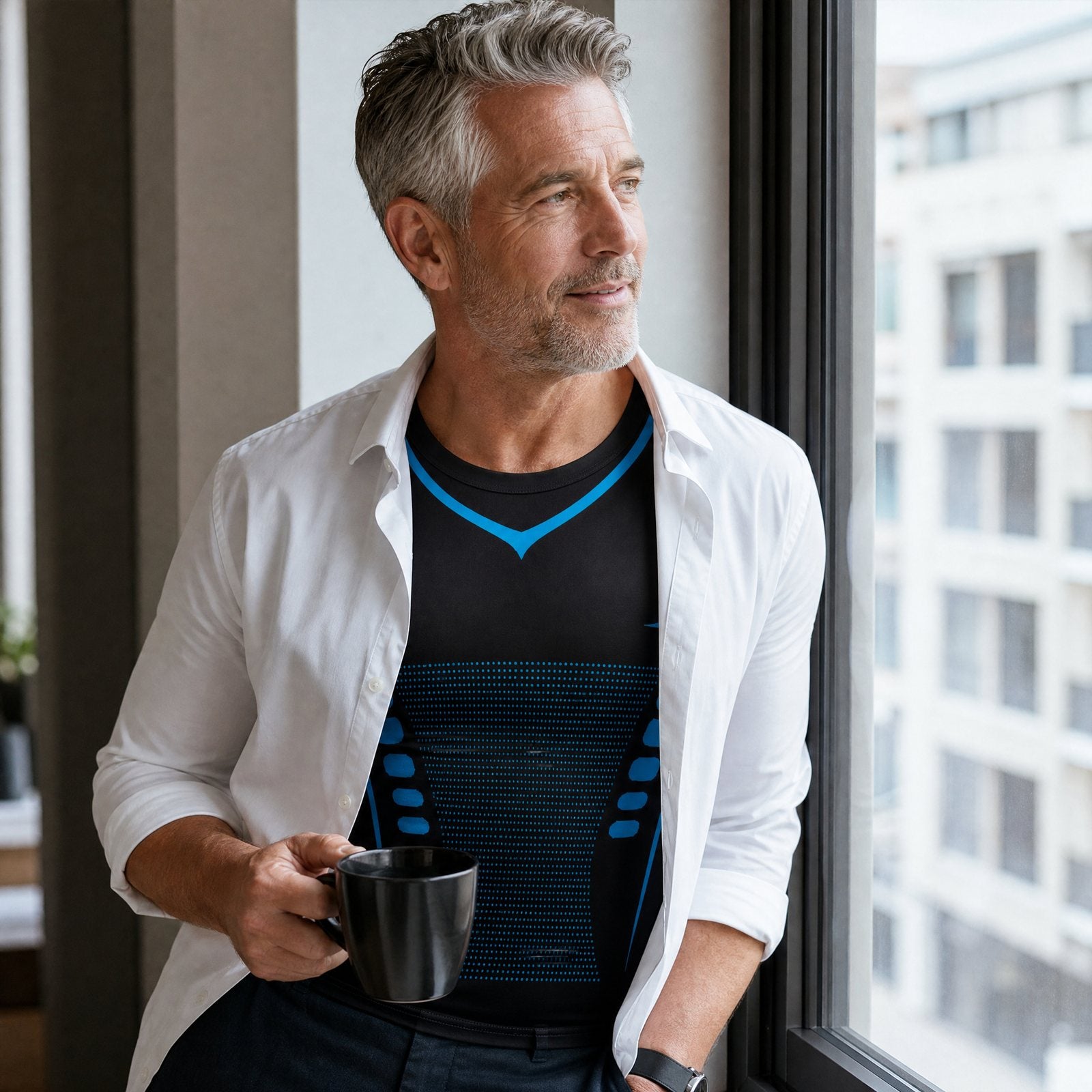 Man at an office window with the DEFYNMEN compression tank under an open white shirt